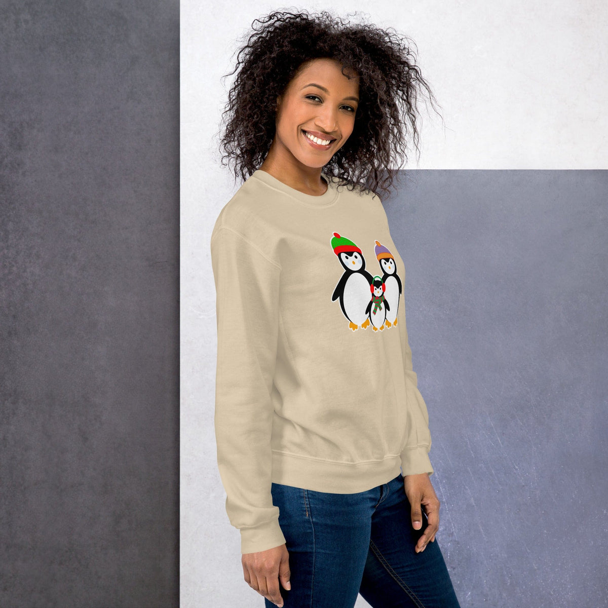 Cream sweatshirt with a penguin family graphic on the front chest.