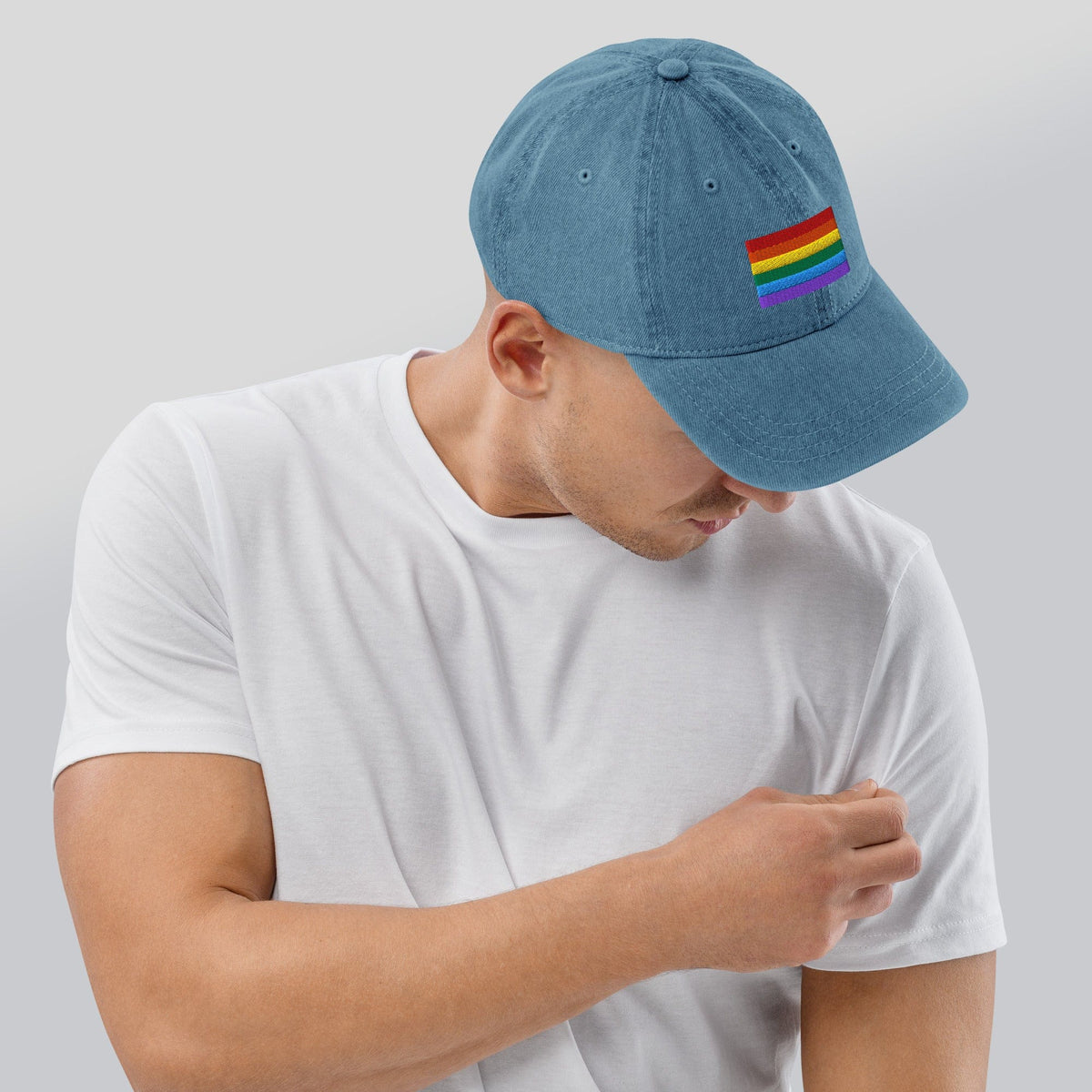 Light blue denim baseball cap with Pride rainbow flag embroidery on the side