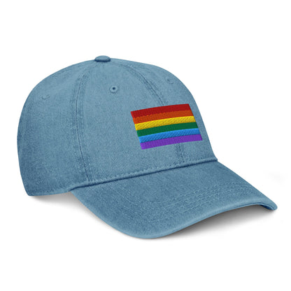 Light blue denim baseball cap with Pride flag patch on front