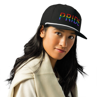Embroidered golf cap in light tan with multicolor PRIDE lettering, front side view