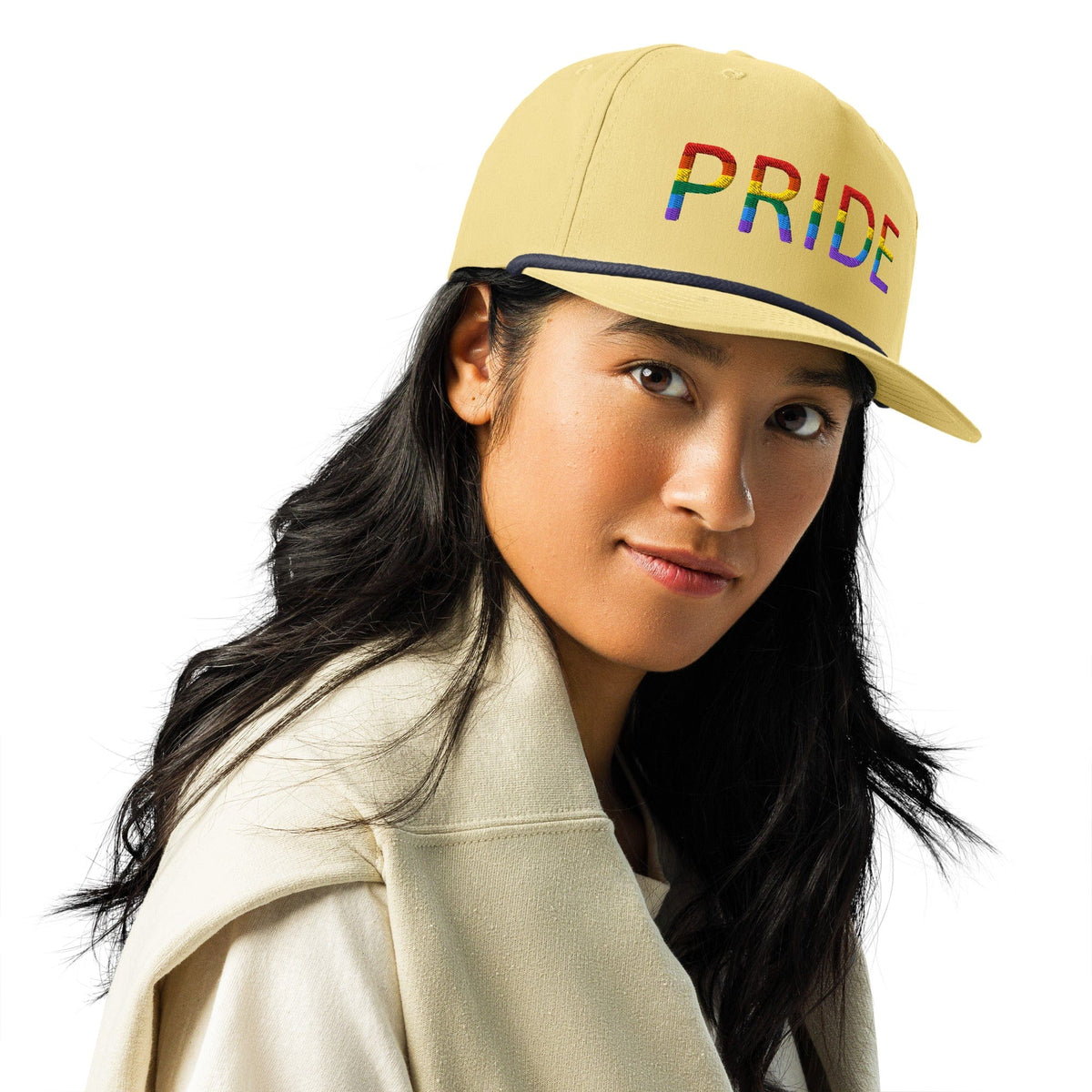 Embroidered golf cap in light tan with multicolor PRIDE lettering