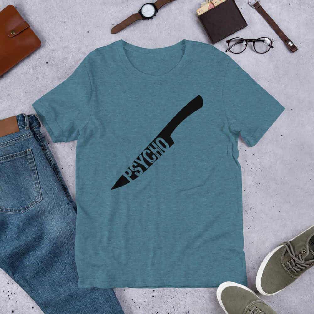 Teal crewneck T-shirt with black knife-style graphic and Psycho text print