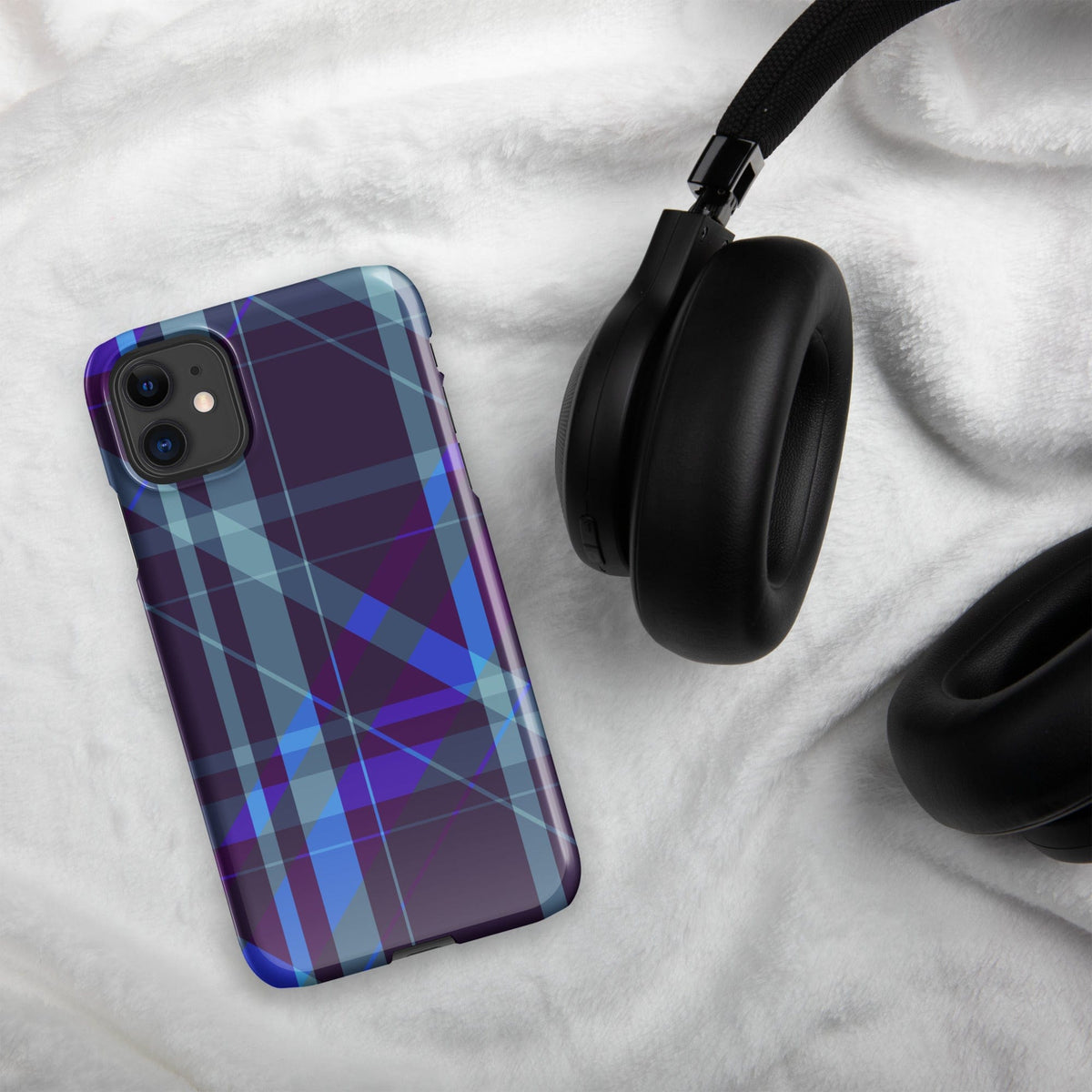 Purple and blue plaid snap iPhone® case on fabric with camera cutouts