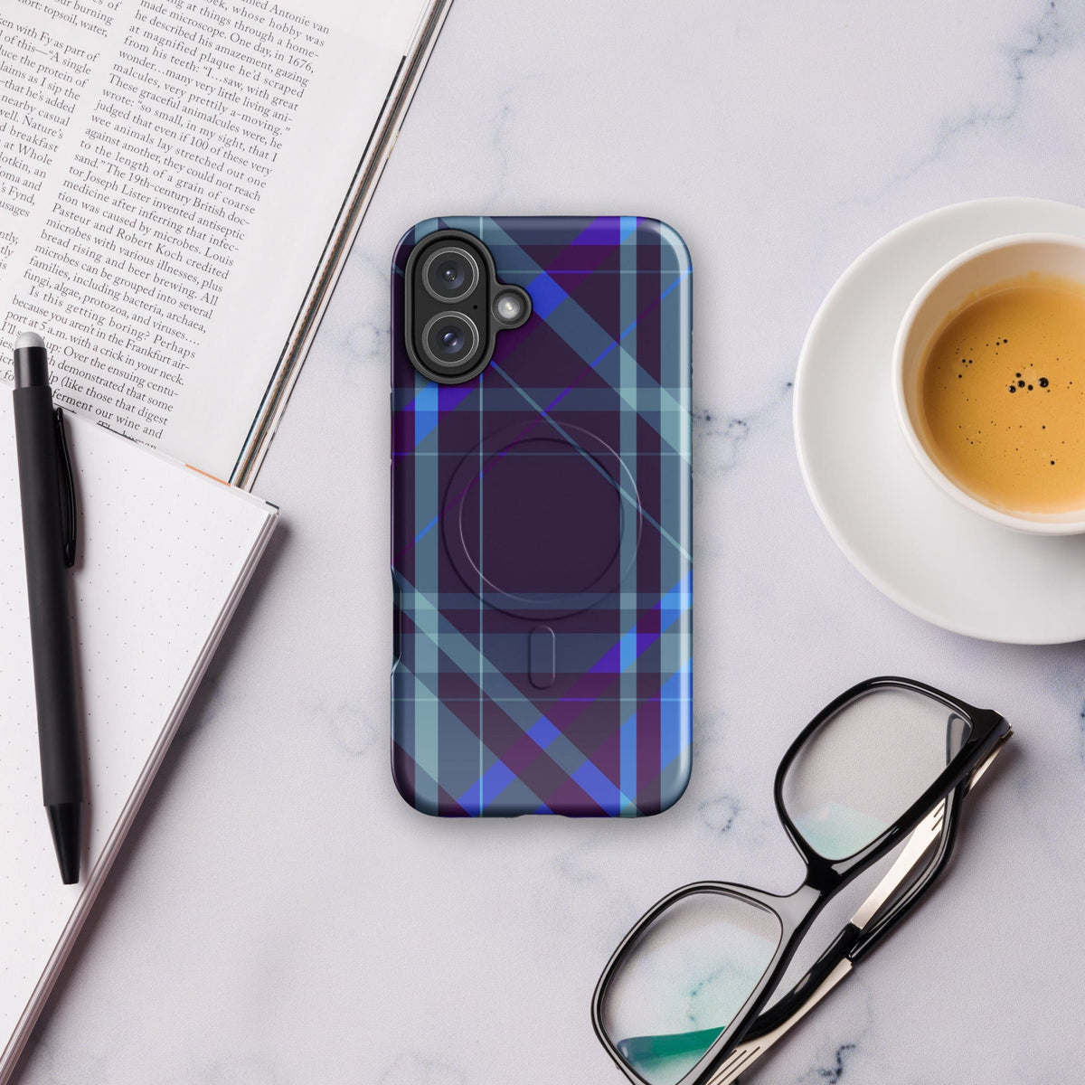 Purple plaid iPhone case showing camera lenses with raised bezel and molded edges