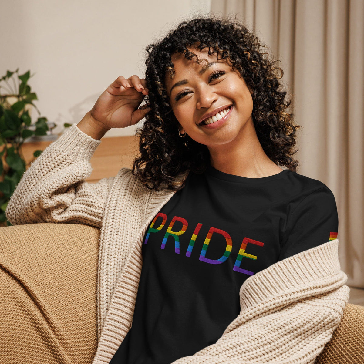 Women’s relaxed t-shirt, black with rainbow PRIDE text graphic