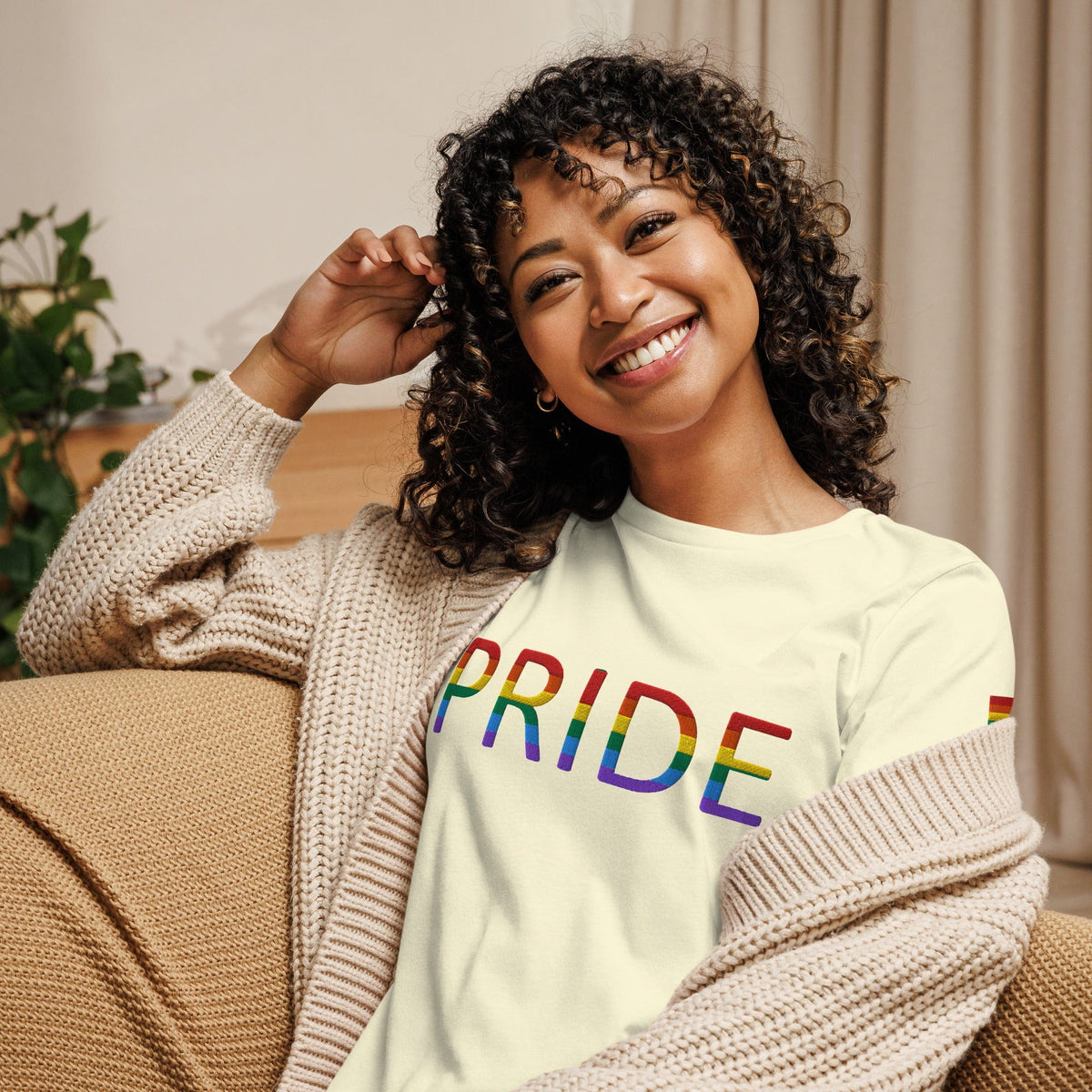 Women’s relaxed t-shirt, off-white with rainbow PRIDE text graphic