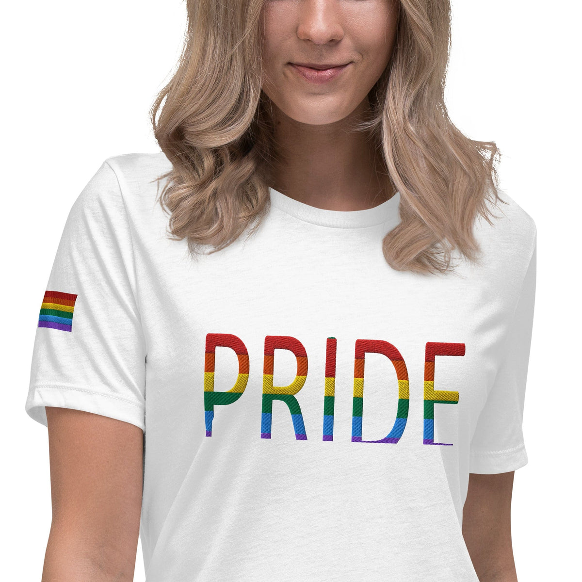 Women's relaxed T-shirt, white with colorful PRIDE text graphic.