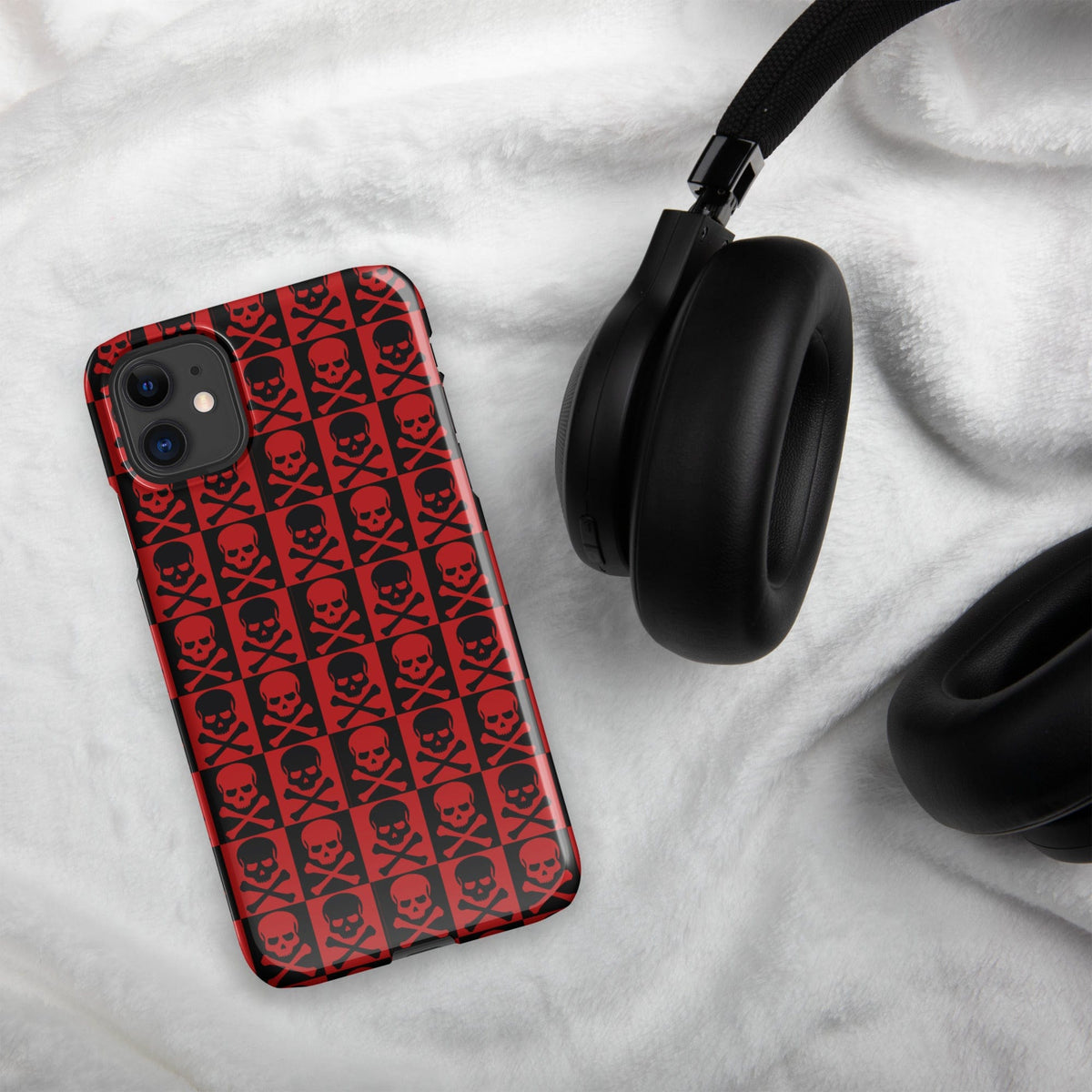 Red skull-pattern iPhone snap case with black outlines and camera cutouts on corners