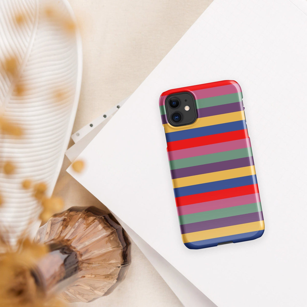 iPhone snap case with horizontal stripes in red, purple, green, and blue