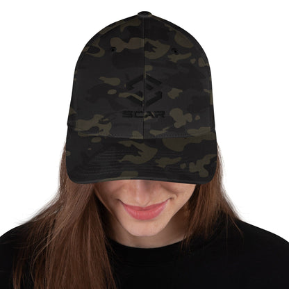 Army camo baseball cap on model, showing front logo and curved brim