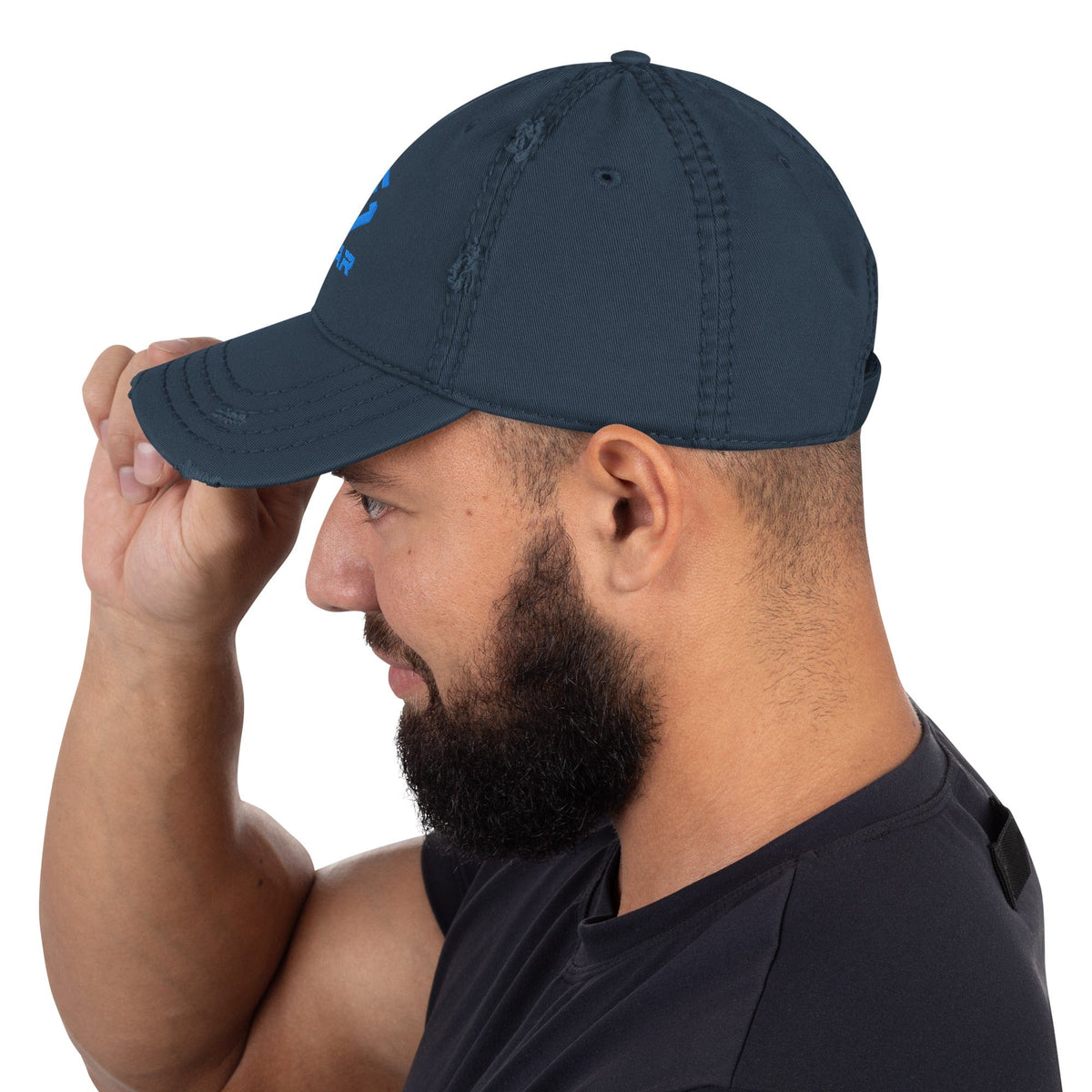 Distressed dad hat in navy with curved brim and side ventilation eyelets