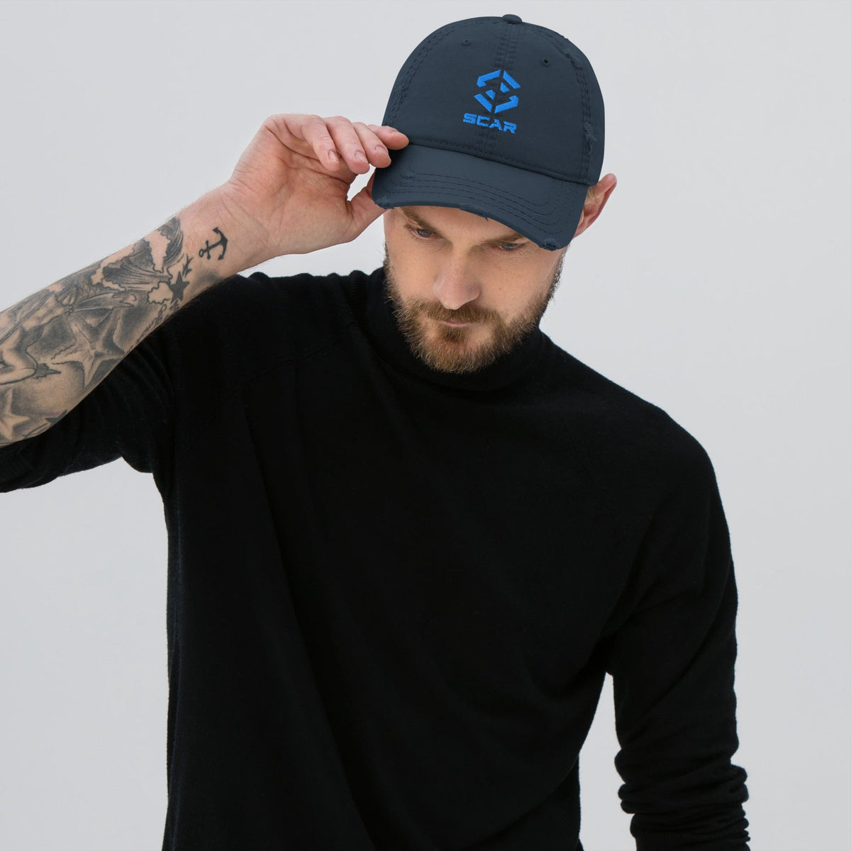 Distressed dad hat with embroidered SCAR logo, navy, model wearing side view