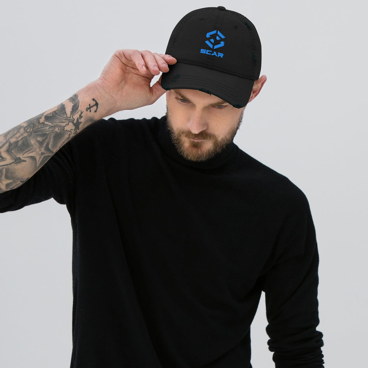 Distressed dad hat with embroidered SCAR logo, black, model wearing side view