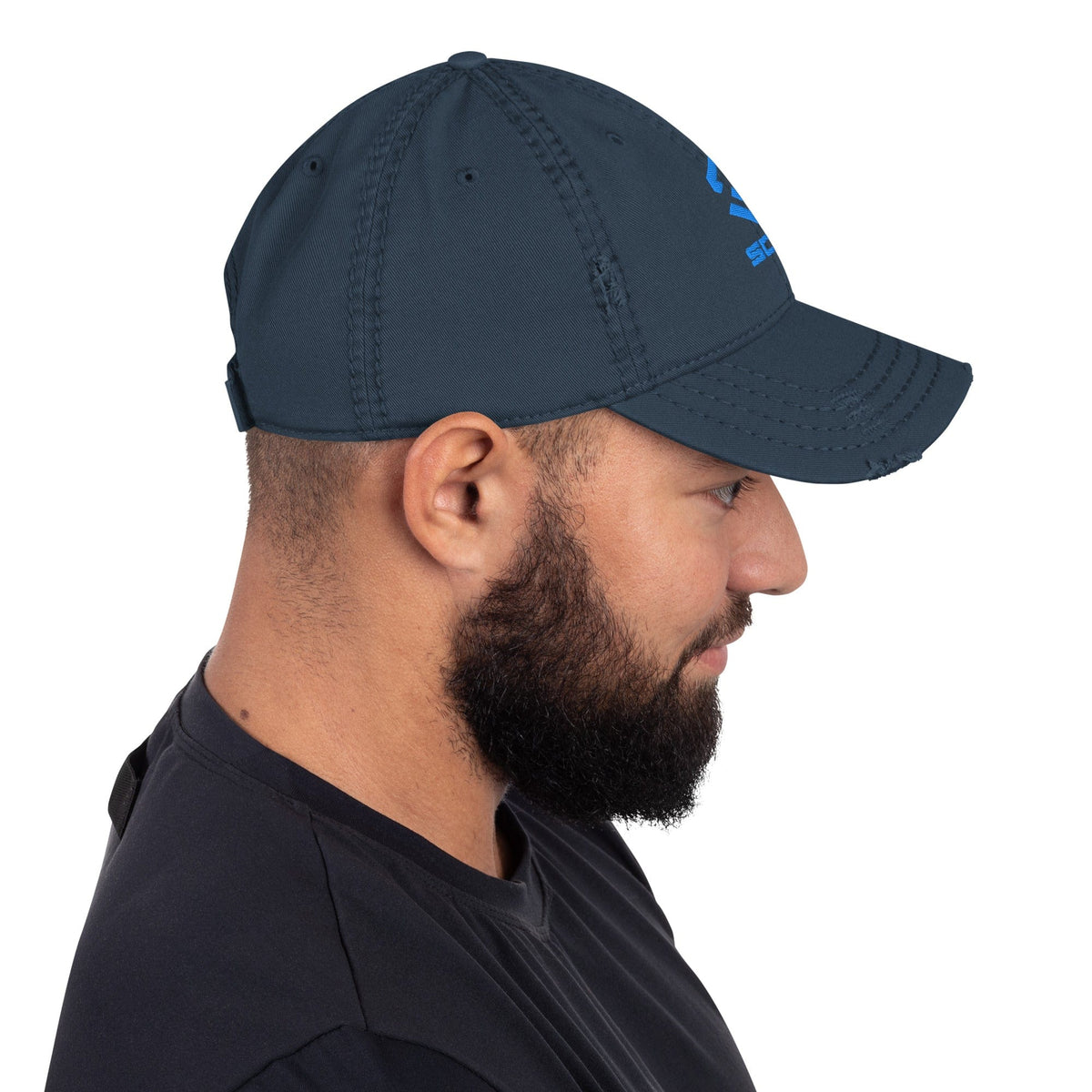 Distressed dad hat in navy with curved brim and small distressed logo mark