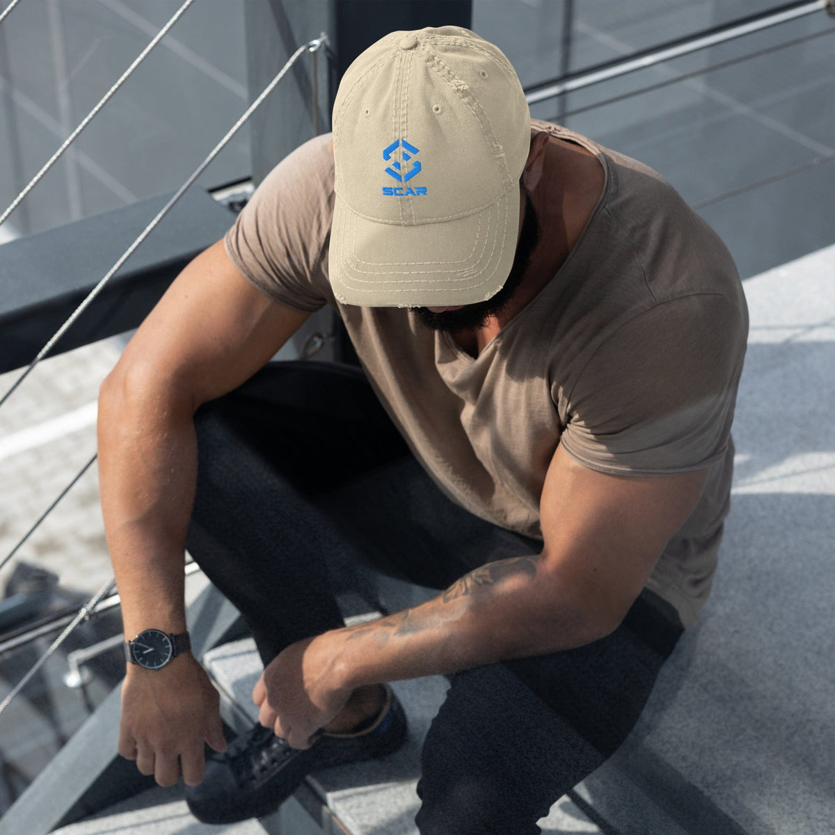 Distressed dad hat with embroidered SCAR logo, khaki, back view on model