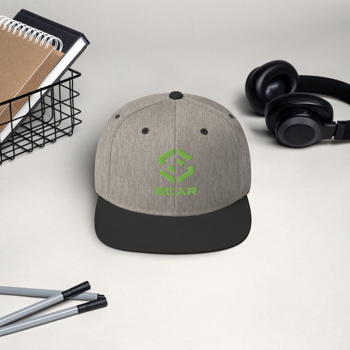 Logo snapback hat in heather gray with dark brim and embroidered SCAR logo