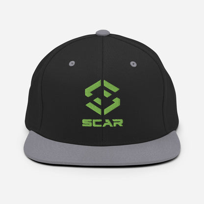 Black snapback hat with gray brim and green SCAR logo embroidery on the front.