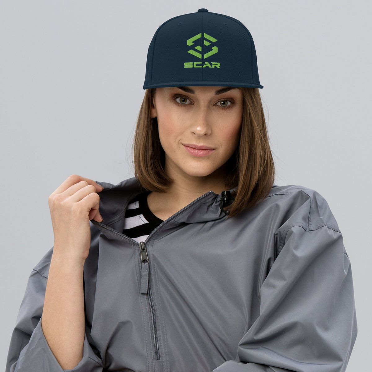 Snapback hat with embroidered SCAR logo, dark teal crown and matching brim.