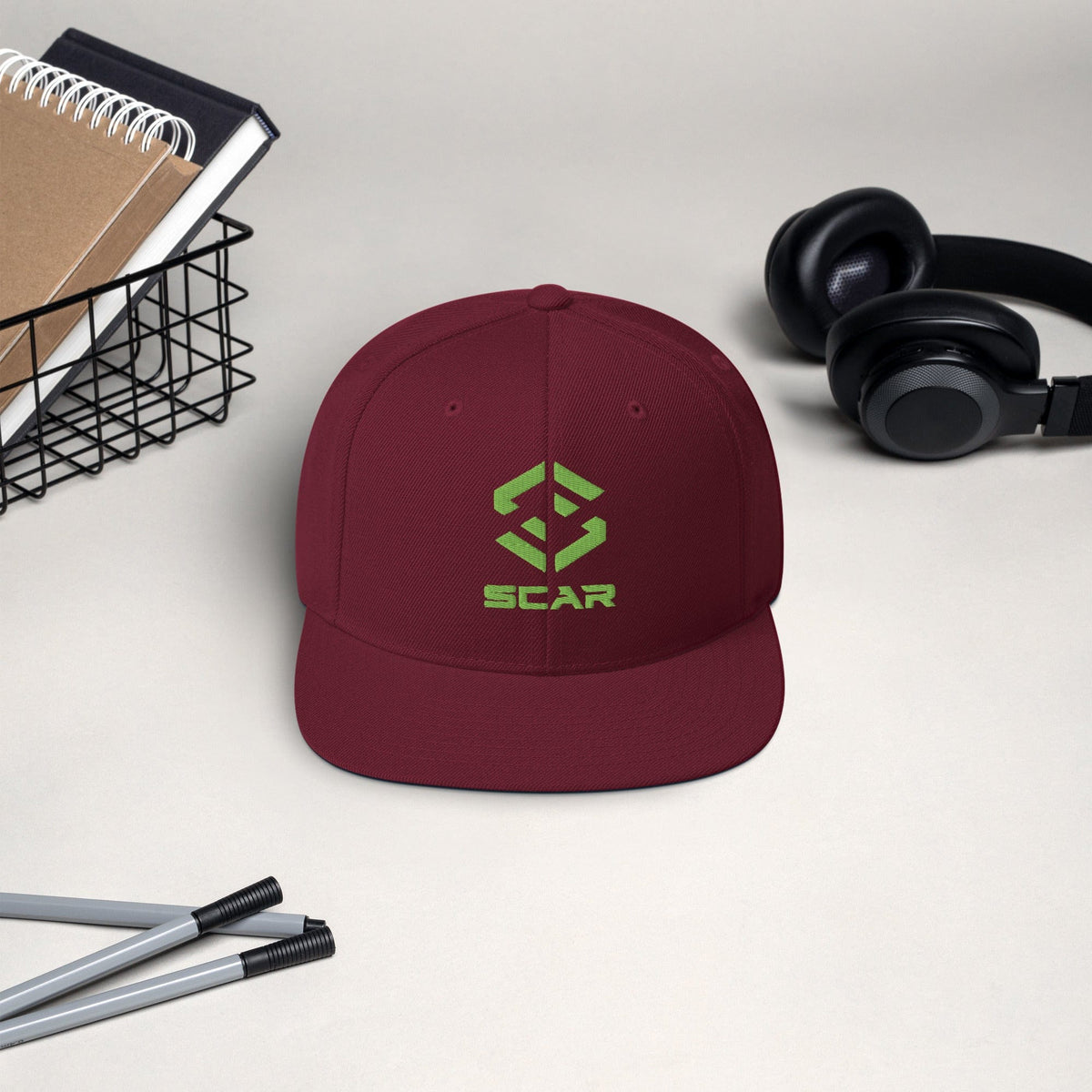 Logo snapback hat in maroon with embroidered SCAR graphic and flat front panel
