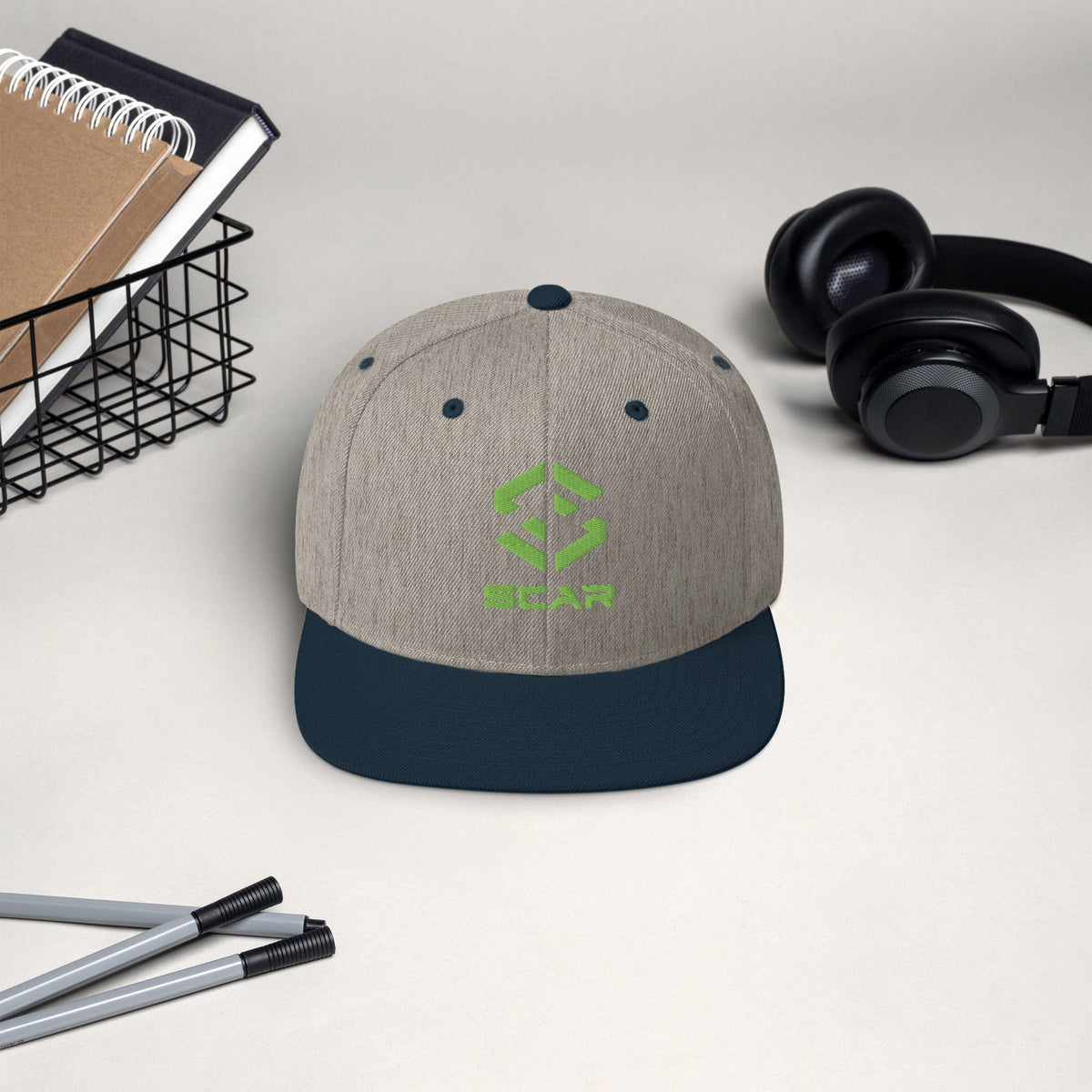 Logo snapback hat in heather gray with dark brim and embroidered SCAR graphic