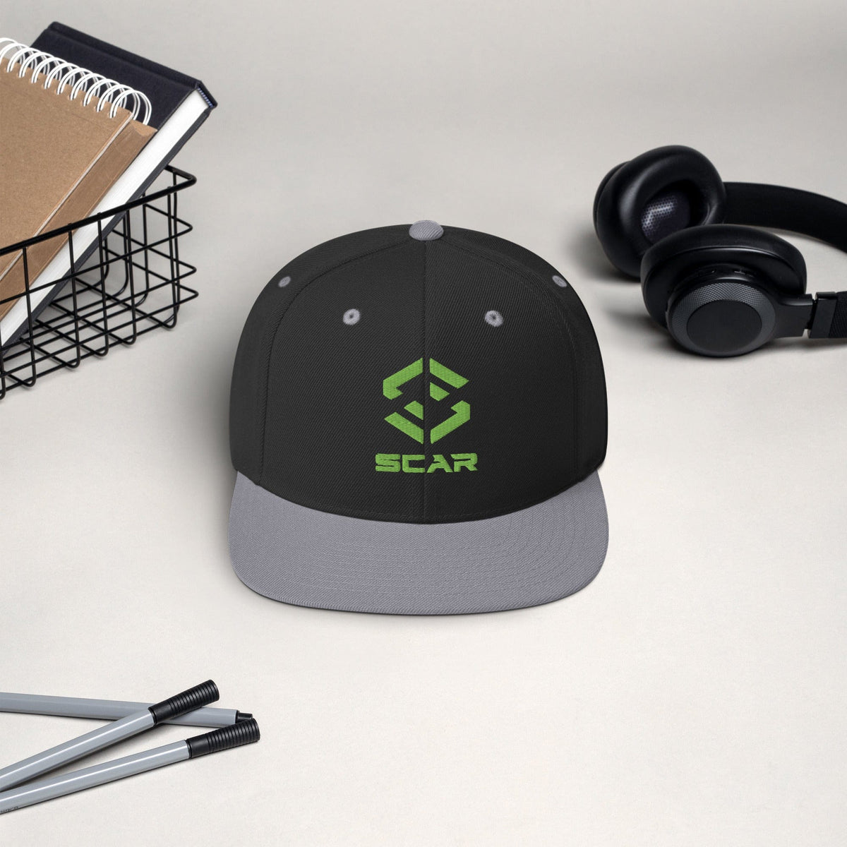 Logo snapback hat in dark charcoal with heather gray brim and embroidered SCAR graphic