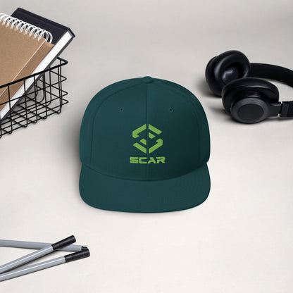 Logo snapback hat in deep teal with embroidered SCAR graphic on the front panel