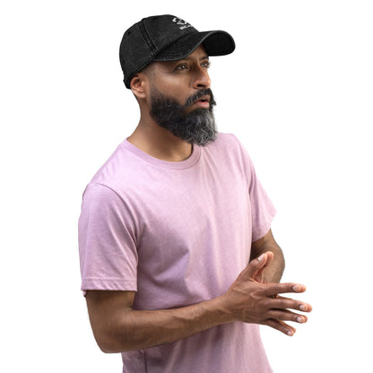 Black vintage cotton twill cap with embroidered STAR logo, worn by a man