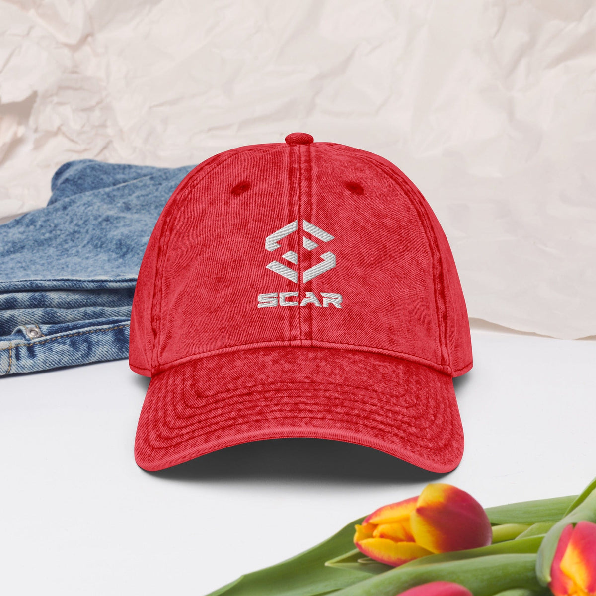 Red vintage cotton twill cap with embroidered logo and curved brim