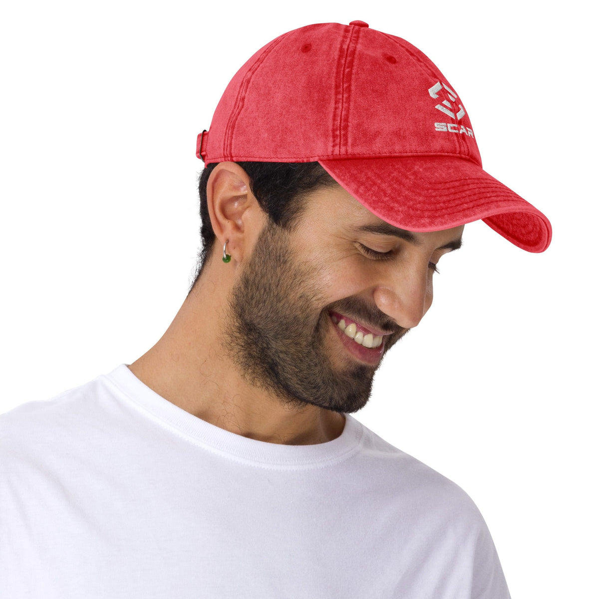 Red vintage cotton twill cap worn by a person, with embroidered logo and curved brim