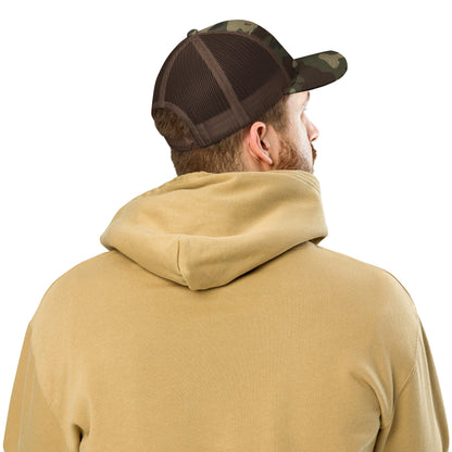 Camouflage trucker cap with black mesh back viewed from the back
