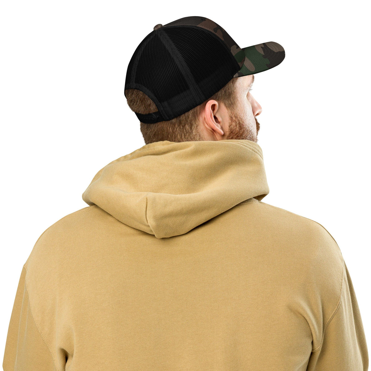 Camouflage trucker hat with black mesh back viewed from the back