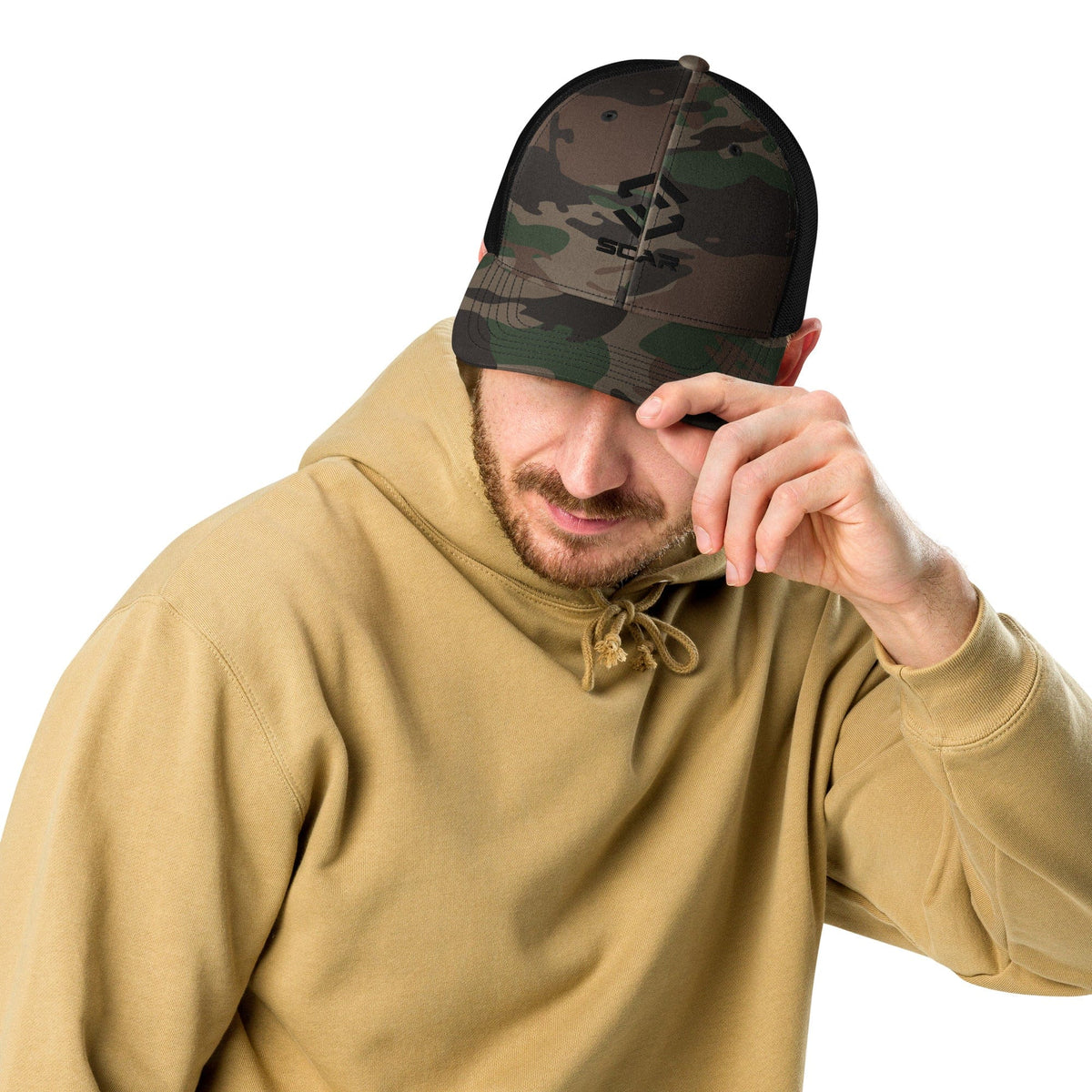 Camouflage trucker hat being worn, front panel shows embroidered Scar logo