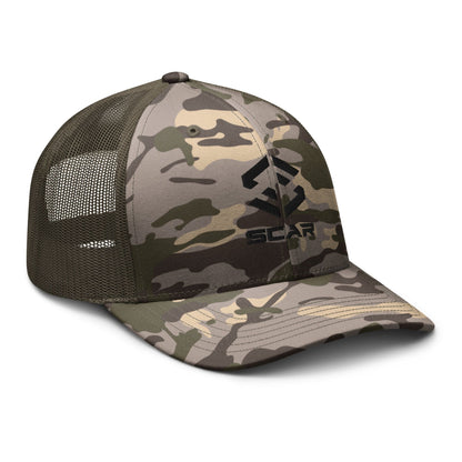 Camouflage trucker hat with embroidered scar logo, dark olive mesh panels and curved brim