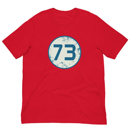 Red T-shirt with circular “73” graphic on the chest.