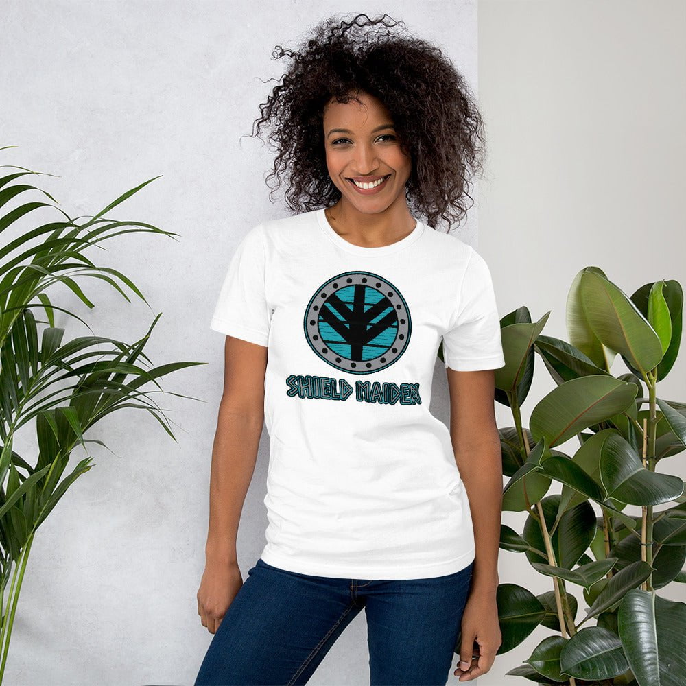 White Shield Maiden graphic T-shirt with circular teal emblem on the chest