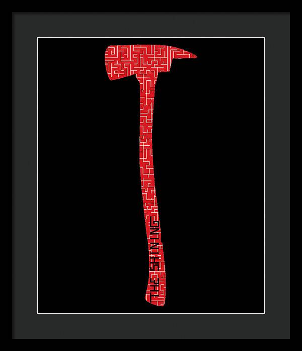 Framed print with red geometric axe on black background, dark frame, dark mat
