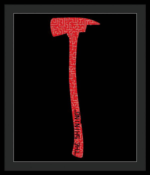 Framed print with red geometric axe silhouette on a black background, black frame