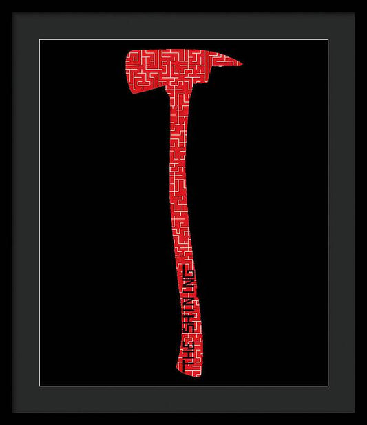 Framed print with red geometric axe silhouette on a black background, black frame