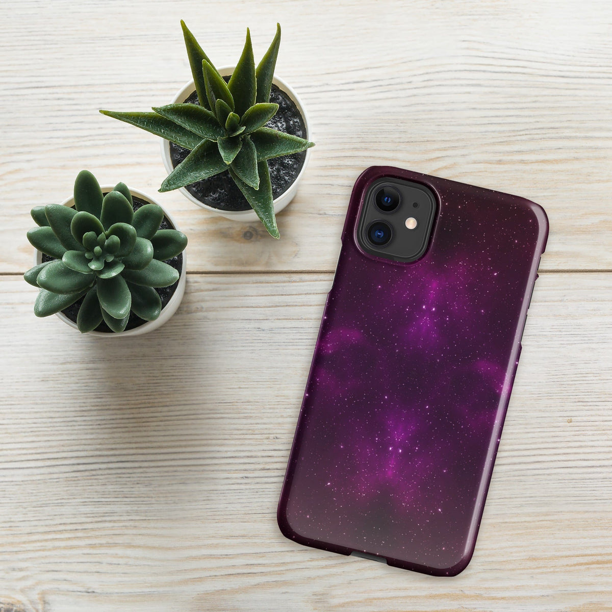Purple galaxy iPhone snap case with dual camera cutout and maroon edge, angled