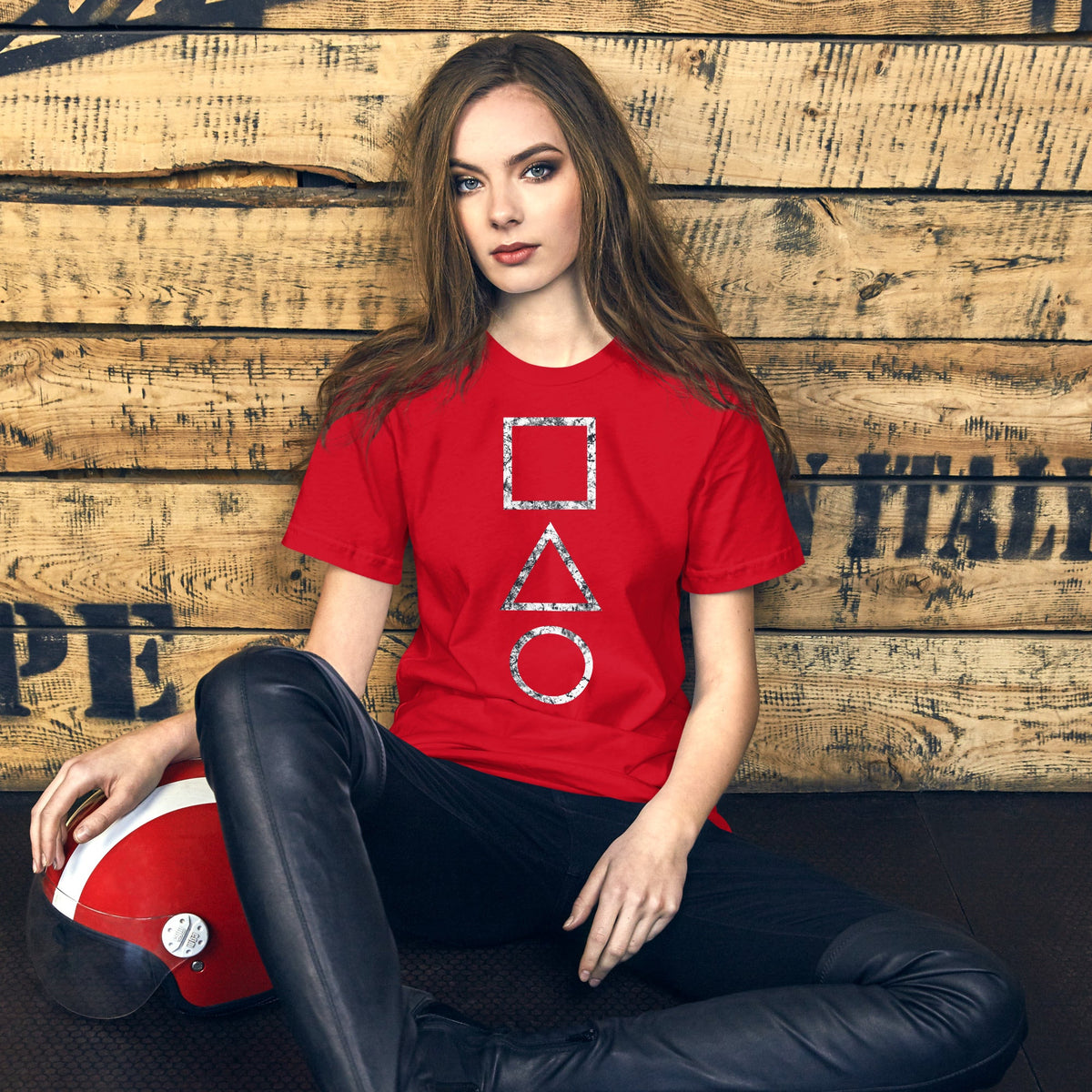 Red T-shirt with stacked square, triangle, and circle graphic on the chest