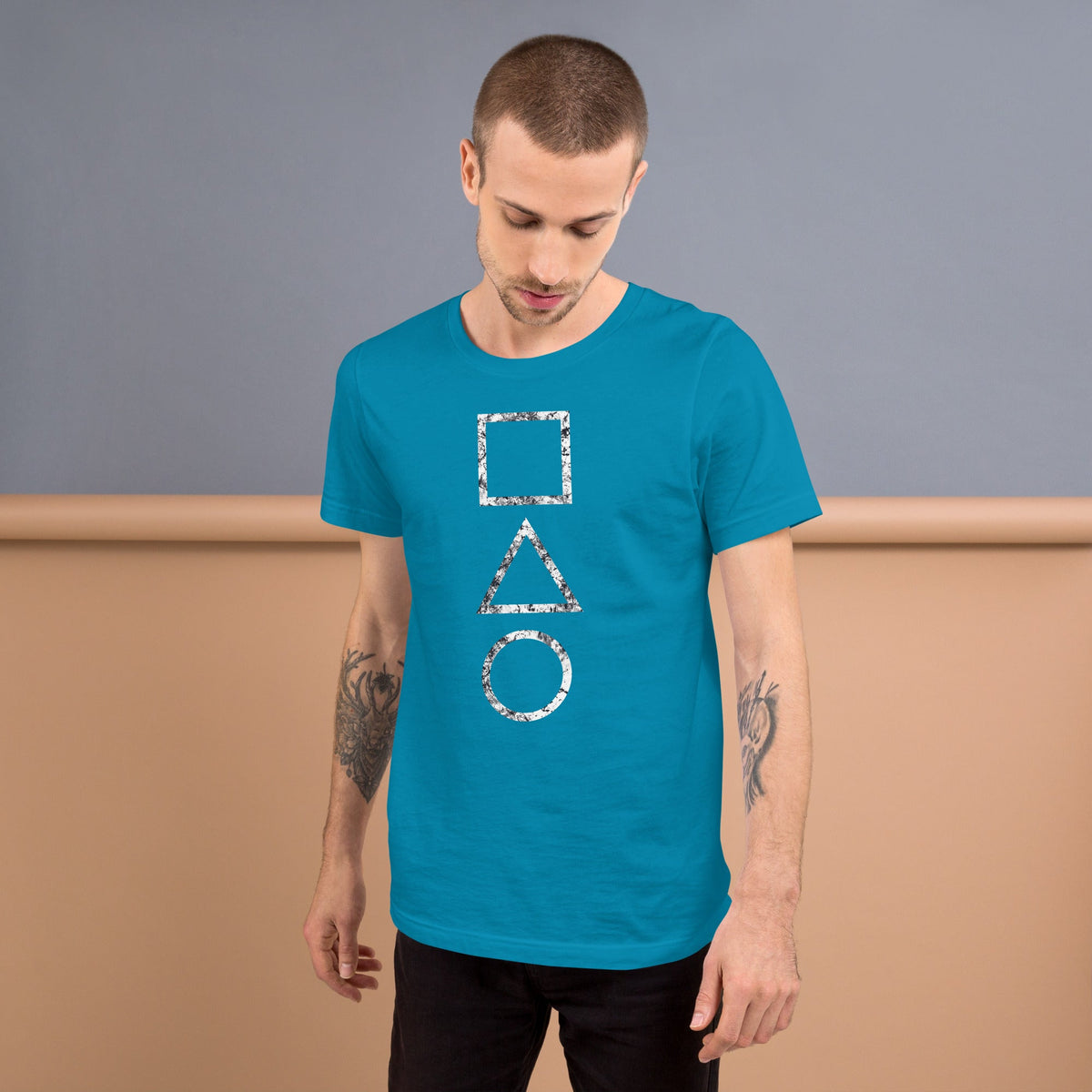 Aqua T-shirt with stacked square, triangle, and circle graphic on the chest