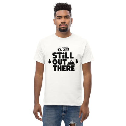 White hiking T-shirt with black 'Still Out There' logo and tree graphic
