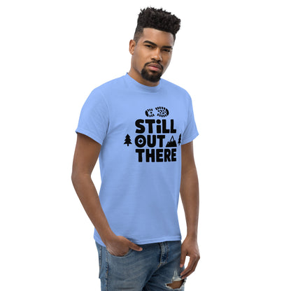Light blue hiking T-shirt with black “Still Out There” logo graphic and paw-tree icon