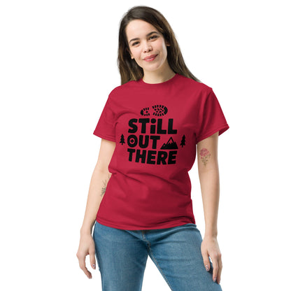 Red hiking T-shirt with black “Still Out There” logo graphic and paw-tree icon