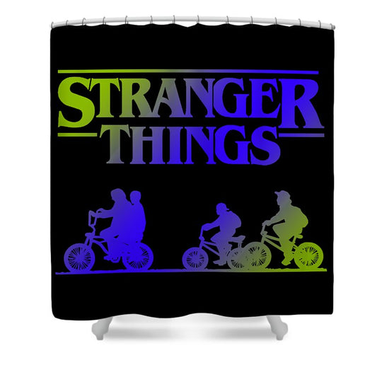Shower curtain with Stranger Things graphic and kids on bicycles