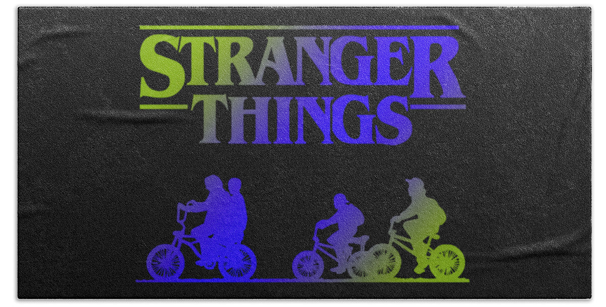 Dark beach towel with multicolor Stranger Things logo and five character silhouettes