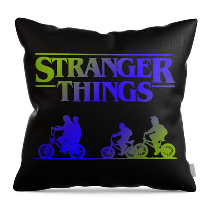 Black throw pillow featuring the Stranger Things logo and colorful riders on bikes.
