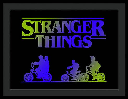 Framed print with black border, colorful “STRANGER THINGS” text, and bike silhouettes.