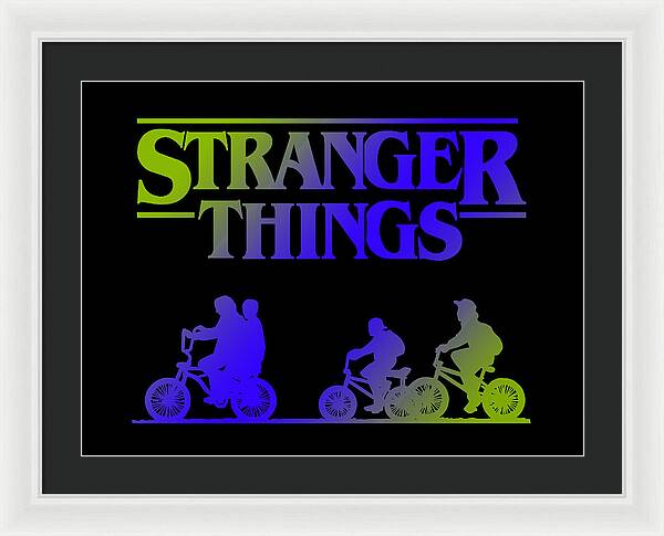 Black-framed Stranger Things print with white mat, multicolor logo and bike silhouettes on dark background.
