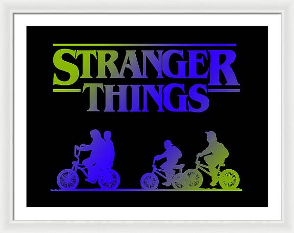 Framed print with white frame and mat, colorful “STRANGER THINGS” text, and bike silhouettes on black.
